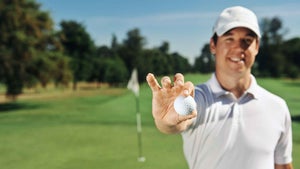 golfer holding ball