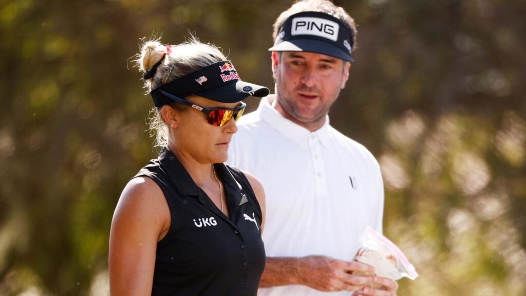 Lexi Thompson and Bubba Watson talk on the course during the 2021 QBE Shootout