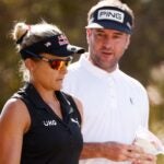 Lexi Thompson and in addition Bubba Watson talk across the course during the 2021 QBE Shootout