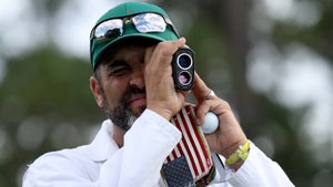 Caddie Michael Greller uses his rangefinder at Augusta National?