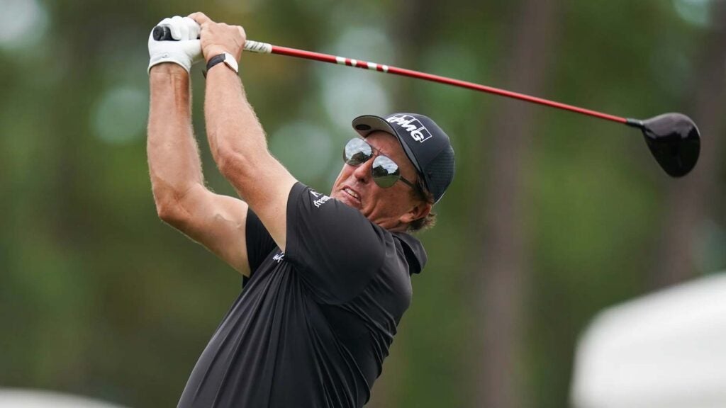 Phil Mickelson pictured mid driver swing at pro golf event