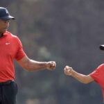 tiger and charlie woods bump fists