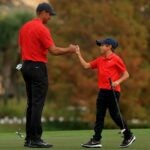Tiger Woods and Charlie Woods bump fists at the 2021 PNC Championship