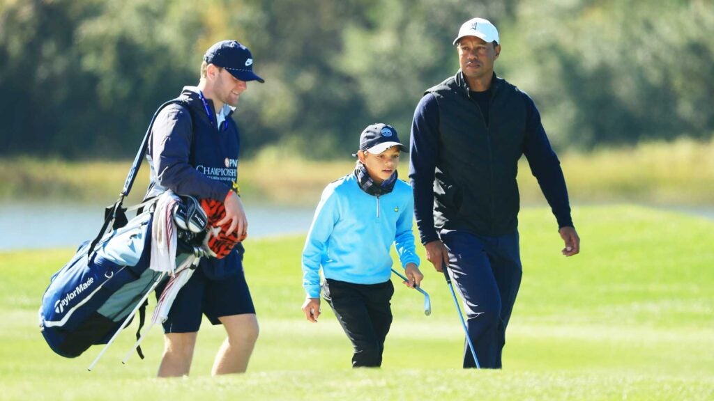 Tiger Woods and Charlie Woods walk the course during the 2020 PNC Championship