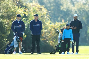 ORLANDO, FLORIDA - DECEMBER 18: Tiger Woods of the United States, his son and playing partner Charlie Woods and their caddies Joe LaCava and his son Joe LaCava Jr. look on over the eighth hole during the pro-am prior to the PNC Championship at the Ritz-Carlton Golf Club Orlando on December 18, 2020 in Orlando, Florida. (Photo by Mike Ehrmann/Getty Images)