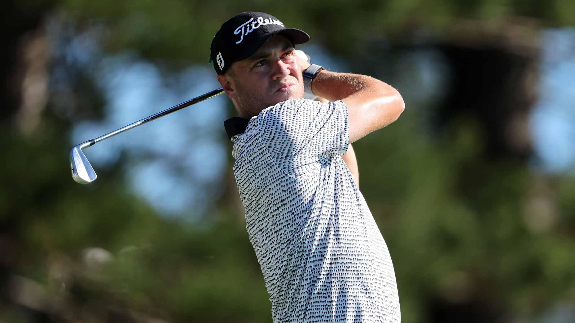 Justin Thomas hits an iron shot during a recent PGA Tour event