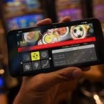 Person uses mobile golf betting app on their phone while inside a casino