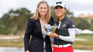 mollie marcoux samaan and lydia ko pose with a trophy