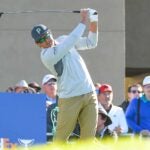 Rickie Fowler hits tee shot during first round of 2022 Farmers Insurance Open