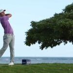 Russell Henley hits a tee shot at the Sony Open.
