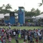 Fans storm the green at the Sony Open.