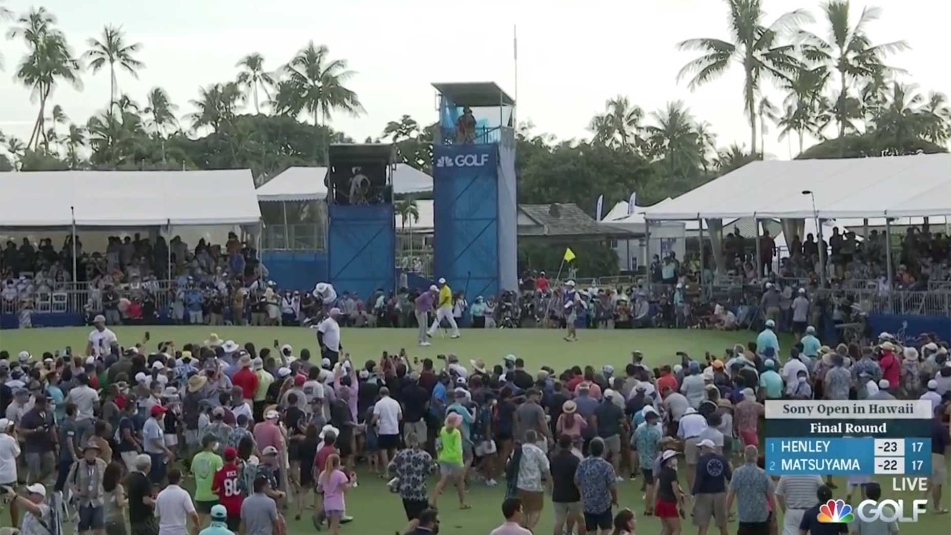 Fans storm the green at the Sony Open.