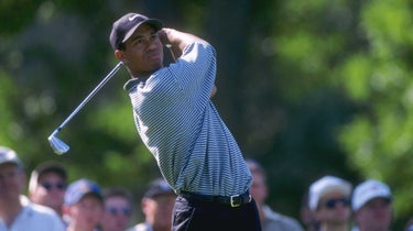 Tiger Woods watches a shot during the Greater Milwaukee Open in 1996.