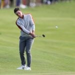 Viktor Hovland chips at the Ryder Cup.