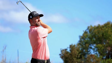 Webb Simpson hits a shot at a golf tournament