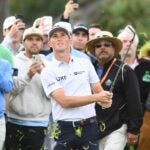 Will Zalatoris watches shot with fans behind him at 2022 Farmers Insurance Open