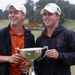 Pierceson and Parker Coody of the Texas men's golf team pose with the East Lake Cup in 2019.