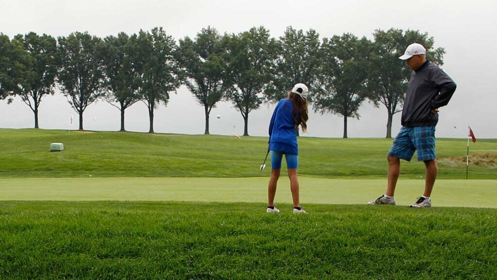 golf parent with daughter