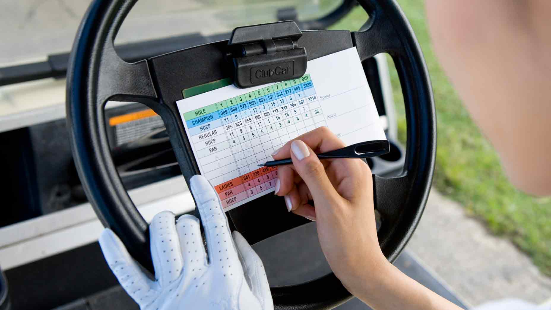 Woman writing scorecard