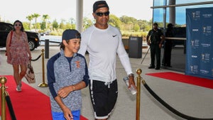 tiger woods arives with son, Charlie