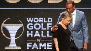 tiger woods hugs his mother