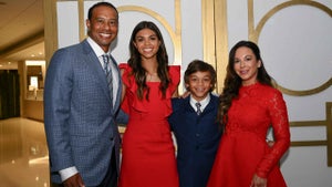 tiger woods poses with his family