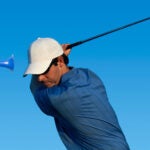 golfer swinging with airhorn in face