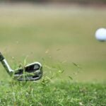 iron hits golf ball