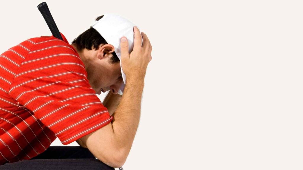 golfer with head in his hands