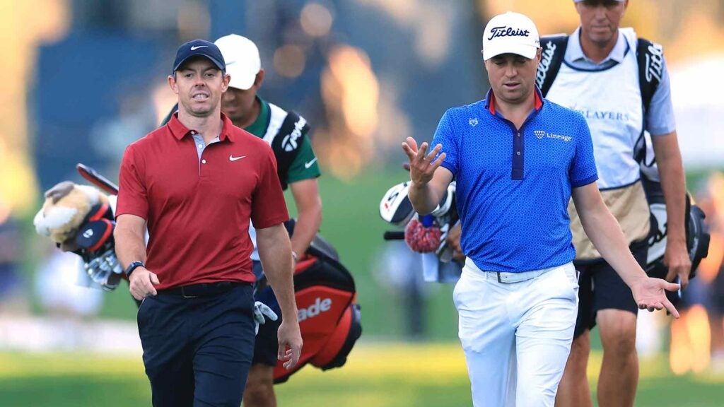 Rory McIlroy and Justin Thomas walk and talk during 2022 Players Championship