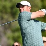 Rory McIlroy watches an iron shot during the 2022 Genesis Invitational