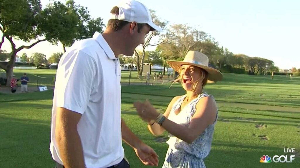 Scottie Scheffler and his wife, Meredith, celebrate after he won the Arnold Palmer Invitational on Sunday at Bay Hill.