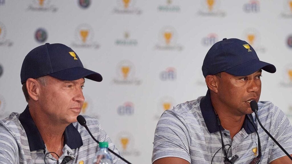 Captain's Assistants Davis Love III and Tiger Woods of the American Team are interviewed after practice rounds prior to the Presidents Cup at Liberty National Golf Club on September 27, 2017 in Jersey City, New Jersey.