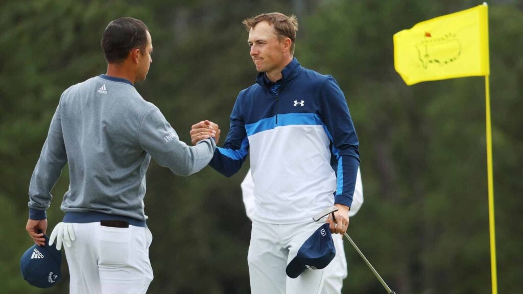 Jordan Spieth and Xander Schauffele at the conclusion of the 2022 Masters.