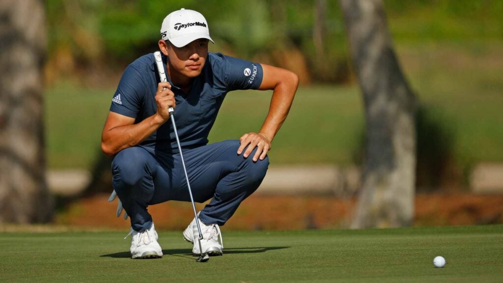 Collin Morikawa reads a putt at 2022 Zurich Classic