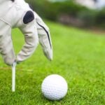 Marking golf ball with tee