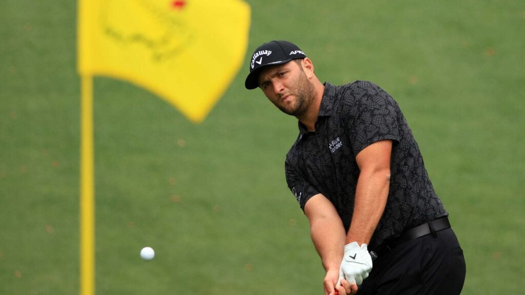 Jon Rahm plays shot in front of flagstick at 2021 Masters