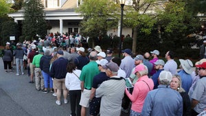 Masters patrons wait in line at Golf Shop