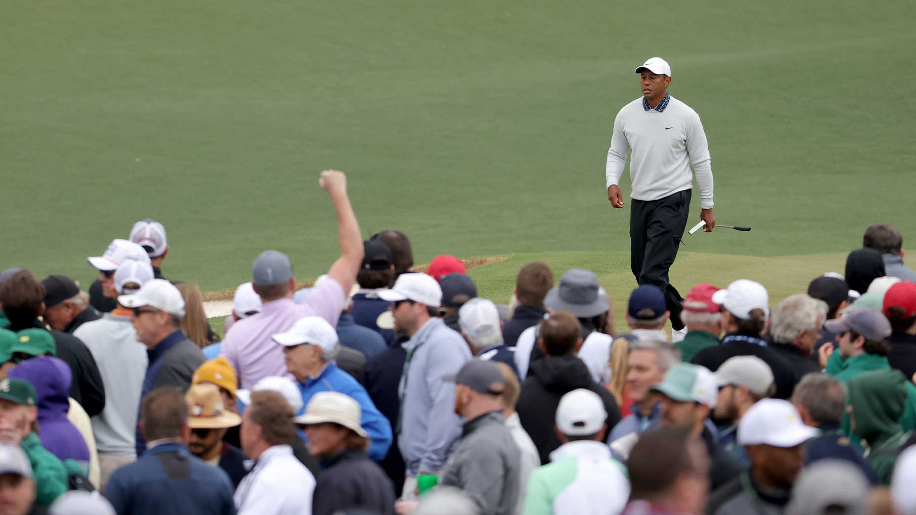 tiger woods walks crowd