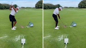 tiger woods hits balls on the range