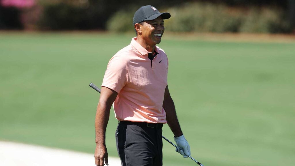 Tiger Woods laughs during a practice session at Augusta on Sunday.