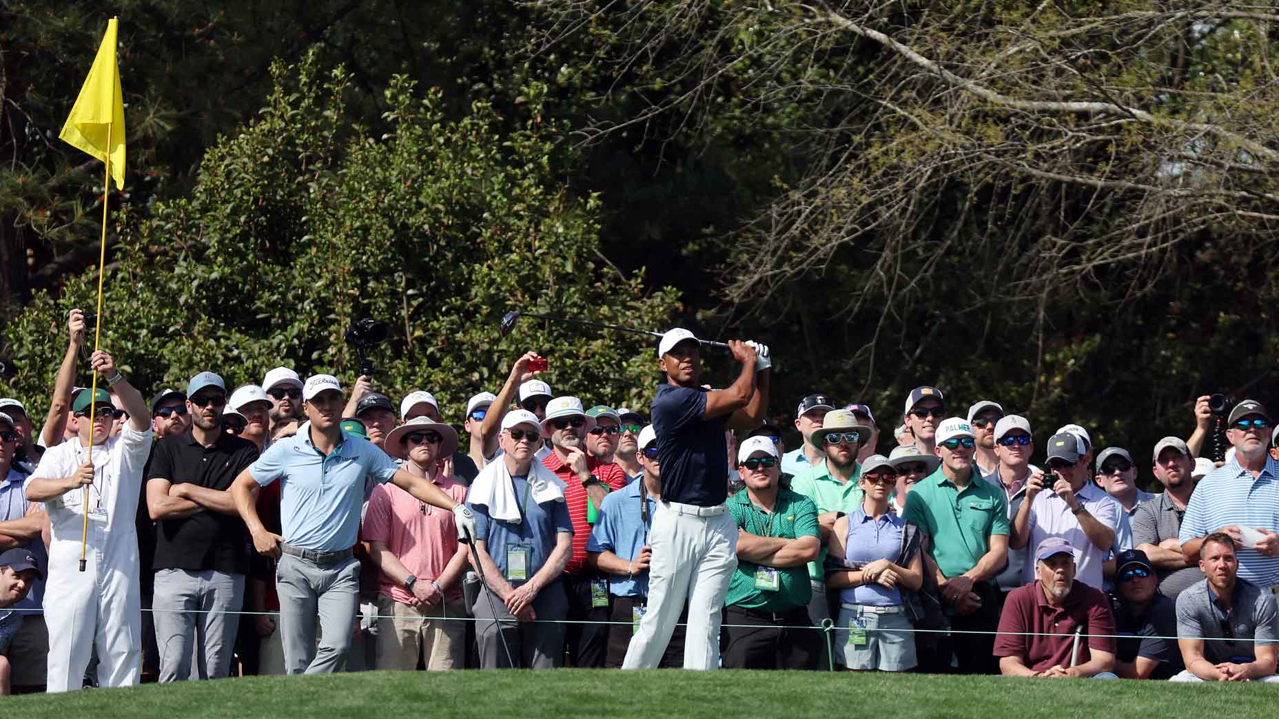 Tiger Woods hits shot in front of fans in practice round for 2022 Masters