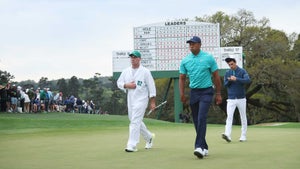 tiger woods walks off the green on friday