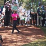 Tiger Woods hits a shot out of the pine straw on Thursday at the Masters.