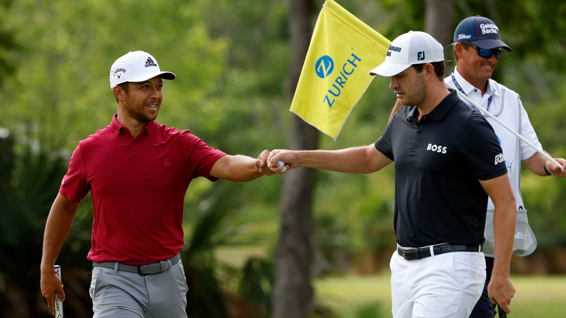 Xander Schauele and Patrick Cantlay fist bump Saturday at the 2022 Zurich Classic