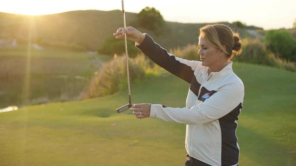 Kelley Brooke demonstrates golf drill