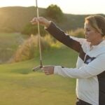 Kelley Brooke demonstrates golf drill