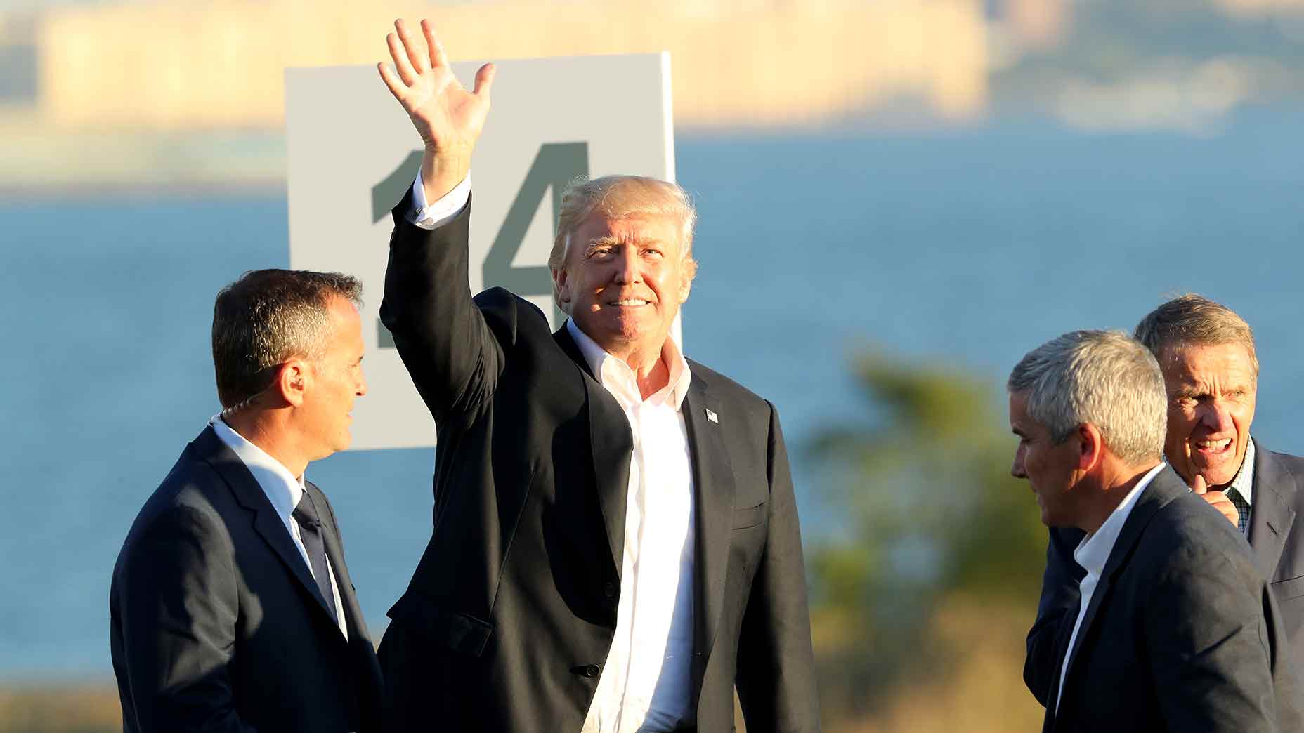 Donald Trump waves to the crowd at the 2017 Presidents Cup at Liberty National in New Jersey.
