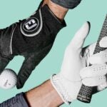 Two hands wearing FootJoy golf gloves