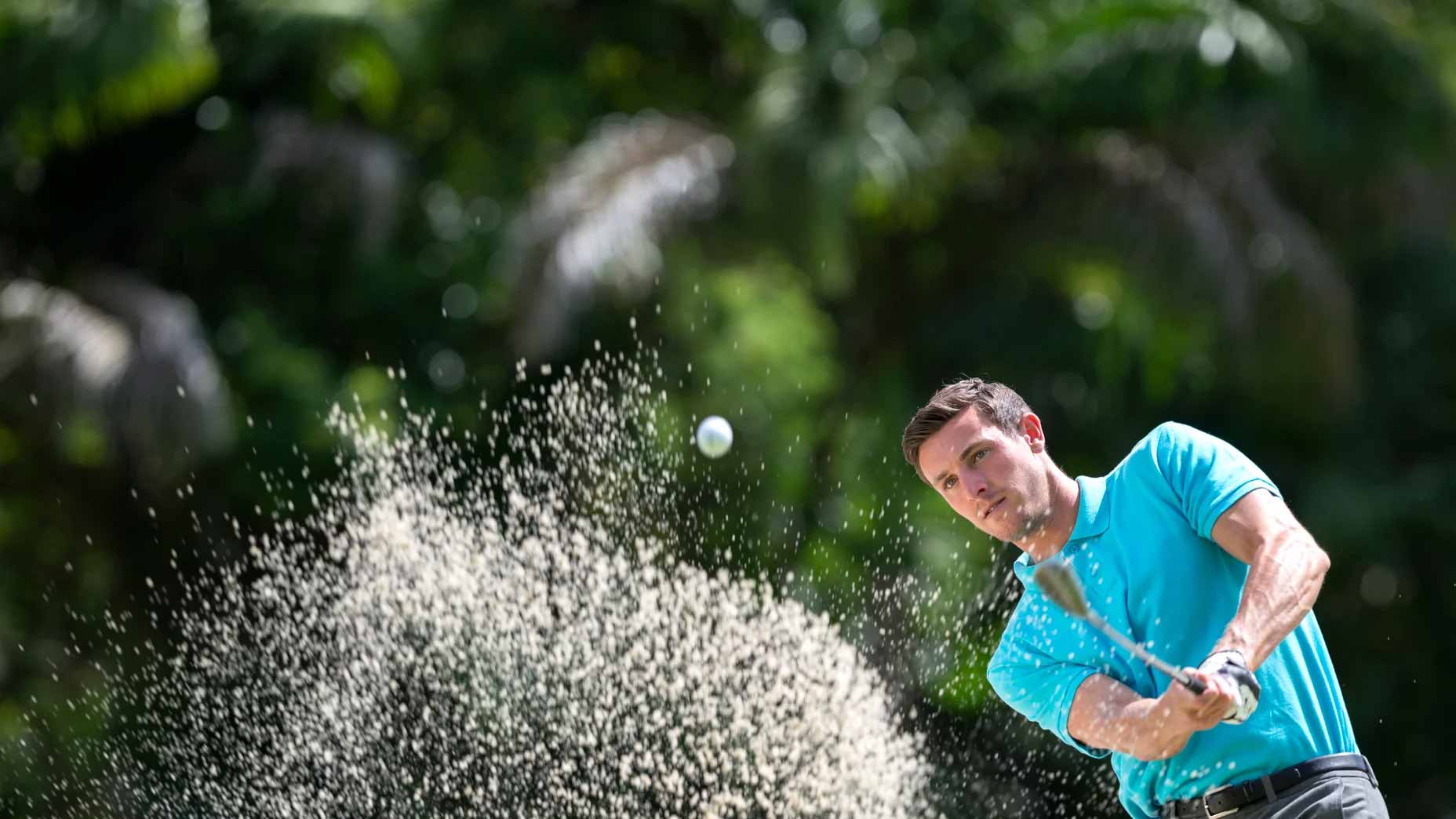 Golfer playing out of a bunker